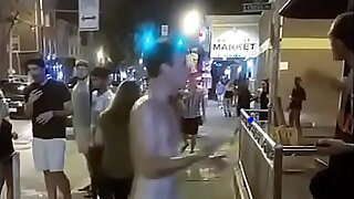 Young man strips naked and walks the downtown streets